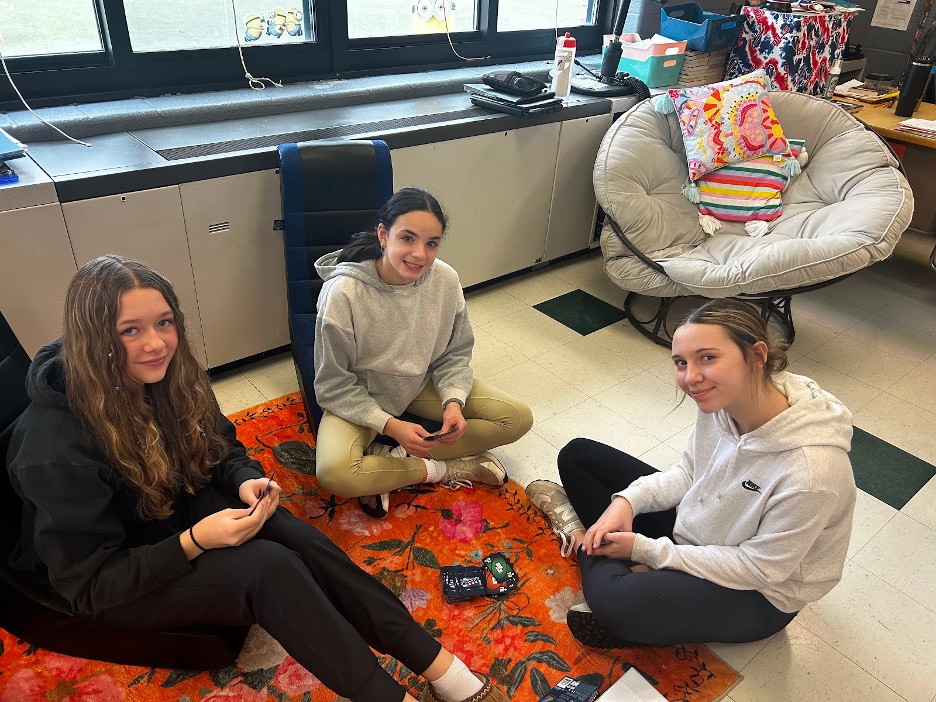 Three girls in Amber Chandler's classroom play Uno